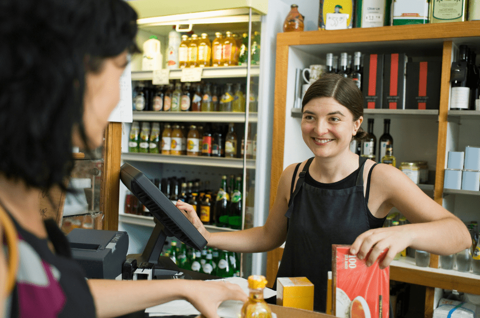 happy cashier with customer showing mindfulness